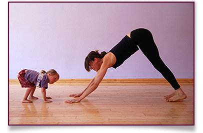 Mother and child doing yoga together